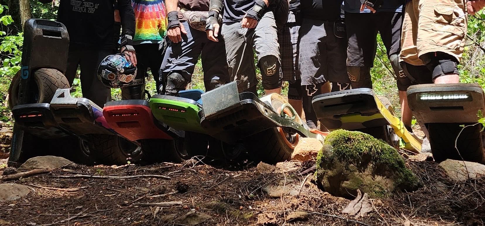 a lineup of onewheels